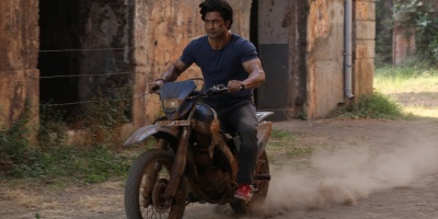 Vidyut Jammwal performing stunts on the bike
